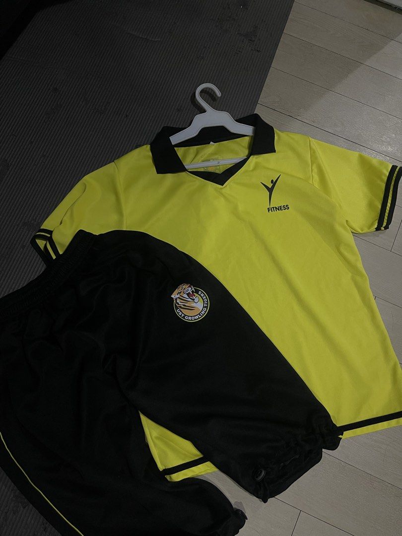 UST PATHFIT FITNESS UNIFORM (Category: Activewear) located in Manila. Submitted by gstuffs. (Listing ID 1448880304, Image 1). Description: - MEDIUM SIZE NO ISSUE ORIGINAL PRICE 1050 selling it for 750 Yellow short-sleeved polo shirt - Black collar and sleeve trim - 'FITNESS' logo on shirt - Black track pants - Yellow side stripe on pants - Circular 'UST GROWLING TIGERS' patch on pants - Ideal for sports or casual wear.