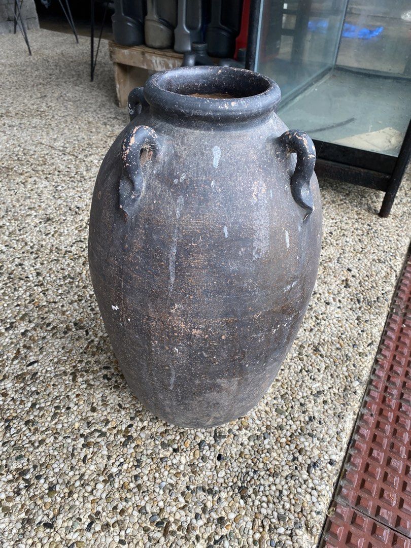 Vintage Dark Clay Pot with Handles (Category: Cookware & Accessories) located in Manila. Submitted by tavorafrancis8096 (Listing ID 1448754827, Image 1). Description: - Old dark clay pot with two handles - Rustic, weathered appearance - Lighter brown interior - Ideal for decorative use or planting - Approximate dimensions: [height] tall x [width] wide - Unique addition to your home or garden.
