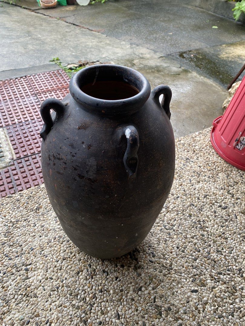 Vintage Dark Clay Pot with Handles (Category: Cookware & Accessories) located in Manila. Submitted by tavorafrancis8096 (Listing ID 1448754827, Image 3). Description: - Old dark clay pot with two handles - Rustic, weathered appearance - Lighter brown interior - Ideal for decorative use or planting - Approximate dimensions: [height] tall x [width] wide - Unique addition to your home or garden.