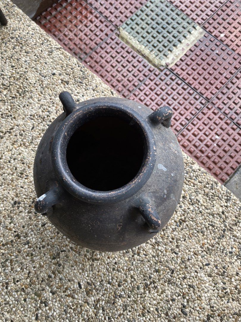 Vintage Dark Clay Pot with Handles (Category: Cookware & Accessories) located in Manila. Submitted by tavorafrancis8096 (Listing ID 1448754827, Image 2). Description: - Old dark clay pot with two handles - Rustic, weathered appearance - Lighter brown interior - Ideal for decorative use or planting - Approximate dimensions: [height] tall x [width] wide - Unique addition to your home or garden.