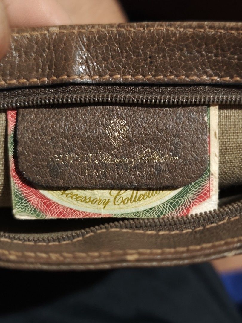 Vintage Gucci Monogram Cosmetic Pouch (Category: Luxury Bags & Wallets) located in Hindang. Submitted by bobbythegrass (Listing ID 1448822049, Image 3). Description: - Vintage Gucci pouch from the Accessory Collection. - Classic GG monogram canvas with brown leather trim. - Features iconic Gucci logo hardware. - Interior includes Gucci authenticity tag and serial number. - Ideal for organizing essentials. P2500.