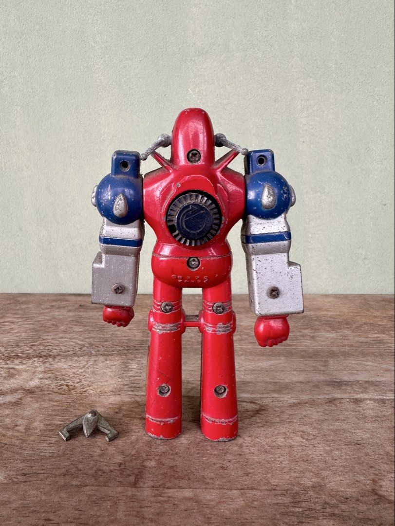 Vintage Mekanda Robot Figure/Toy (Category: Figurines & Statues) located in Mandaluyong City. Submitted by collectorsobsessions (Listing ID 1403834395, Image 3). Description: - Not in Mint or Excellent condition. - Left leg has tape on it. - Right arm is semi-loose and left arm is semi-tight. - Front horn/antenna is loose and falls off when you try to insert it in Mekanda's forehead. - Missing accessories. - Comes as is, what you see is what you 