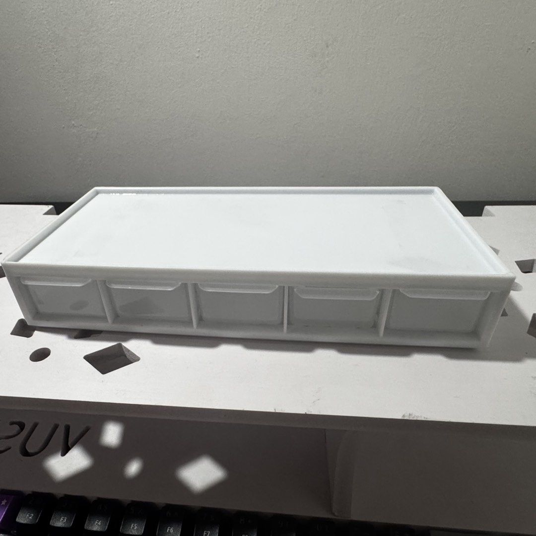 White 5-Drawer Storage Organizer Box (Category: Storage Boxes & Baskets) located in Caloocan City. Submitted by hazyend (Listing ID 1448746187, Image 3). Description: - White organizer box - 5 clear drawers - Ideal for stationery, craft supplies, accessories - Compact size for desk or shelf - Smooth sliding drawers - Clean and simple design.