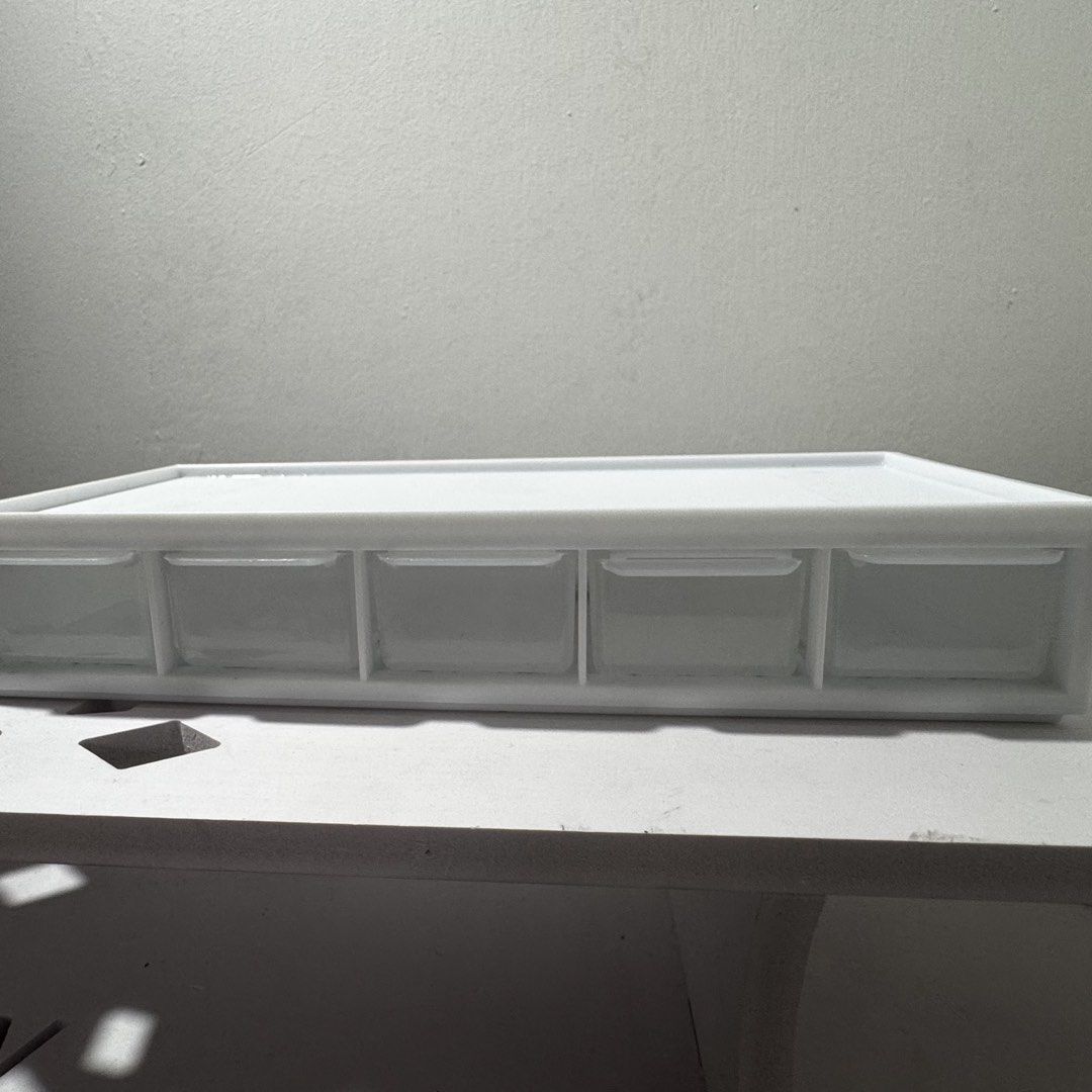 White 5-Drawer Storage Organizer Box (Category: Storage Boxes & Baskets) located in Caloocan City. Submitted by hazyend (Listing ID 1448746187, Image 1). Description: - White organizer box - 5 clear drawers - Ideal for stationery, craft supplies, accessories - Compact size for desk or shelf - Smooth sliding drawers - Clean and simple design.