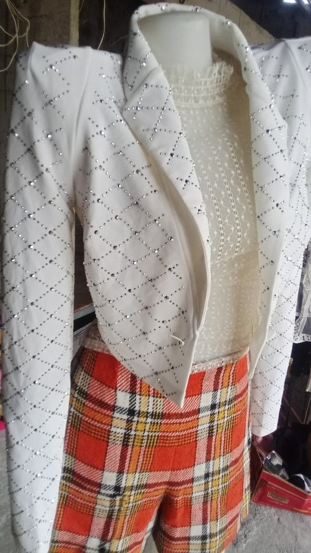White Cropped Jacket with Rhinestones and Padded Shoulders (Category: Coats, Jackets and Outerwear) located in Cavite. Submitted by garinmaric11231 (Listing ID 1448743766, Image 2). Description: - Chic white cropped jacket - All-over diamond pattern with sparkling rhinestones - Padded shoulders for a strong, structured silhouette - Single button closure at the front - Ideal for pairing with high-waisted bottoms - A unique statement piece to eleva