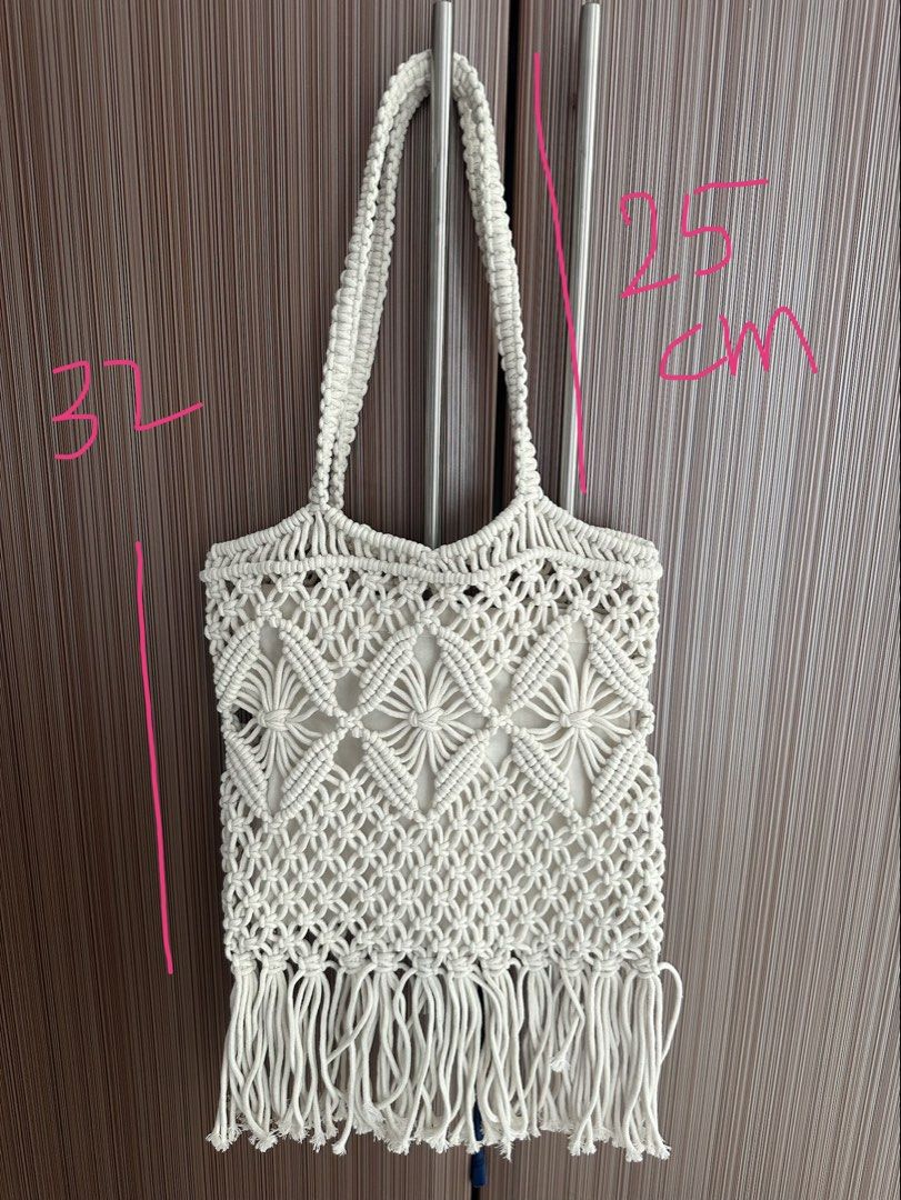 White Macrame Tote Bag with Fringes (Category: Tote Bags) located in Taguig. Submitted by stigmapanda (Listing ID 1448831722, Image 3). Description: - Handmade macrame tote bag - Color: Creamy white - Features intricate woven pattern - Stylish fringe detail at the bottom - Durable macrame handles - Ideal for beach days and casual outings - Approximate dimensions: 32cm (height) x 25cm (width).