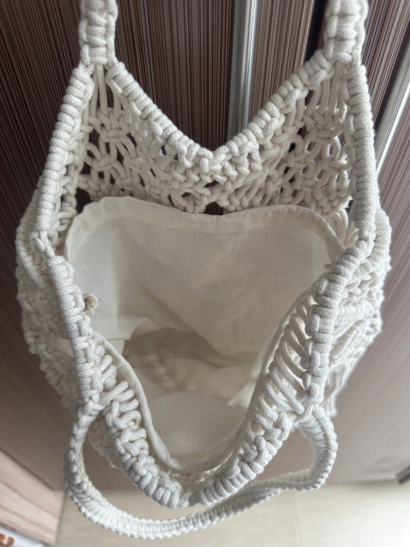 White Macrame Tote Bag with Fringes (Category: Tote Bags) located in Taguig. Submitted by stigmapanda (Listing ID 1448831722, Image 2). Description: - Handmade macrame tote bag - Color: Creamy white - Features intricate woven pattern - Stylish fringe detail at the bottom - Durable macrame handles - Ideal for beach days and casual outings - Approximate dimensions: 32cm (height) x 25cm (width).