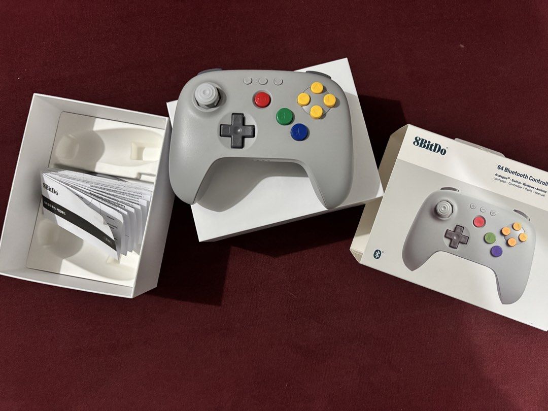 8BitDo 64 Bluetooth Controller (Category: Controllers) located in Manila. Submitted by dondz (Listing ID 1449069928, Image 2). Description: - 8BitDo 64 Bluetooth Controller - Compatible with: Analogue, Nintendo Switch, Windows, Android - Includes: Controller, USB cable, Manual - All items in original packaging - Ideal for retro gaming enthusiasts.