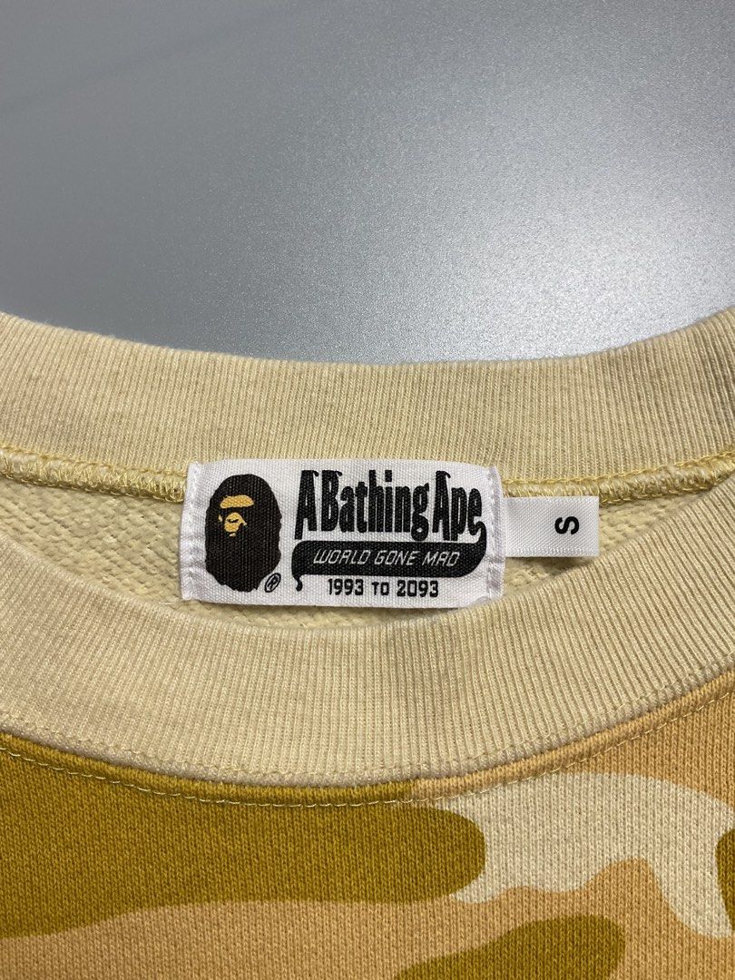 ABC camo (Category: Coats, Jackets and Outerwear) located in San Pablo. Submitted by pj_thrifthings (Listing ID 1449055634, Image 2). Description: This yellow A Bathing Ape Color Camo College Crewneck features a prominent large graphic print on the front. Authentic Guaranteed Small on tag Width - 18.5 Length - 26 Asnew condition Flawless Can do shipping nationwide. .