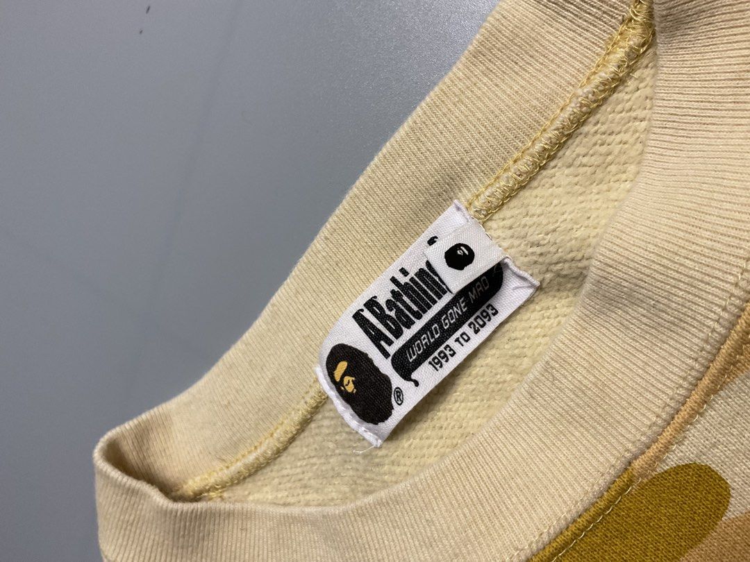 ABC camo (Category: Coats, Jackets and Outerwear) located in San Pablo. Submitted by pj_thrifthings (Listing ID 1449055634, Image 3). Description: This yellow A Bathing Ape Color Camo College Crewneck features a prominent large graphic print on the front. Authentic Guaranteed Small on tag Width - 18.5 Length - 26 Asnew condition Flawless Can do shipping nationwide. .
