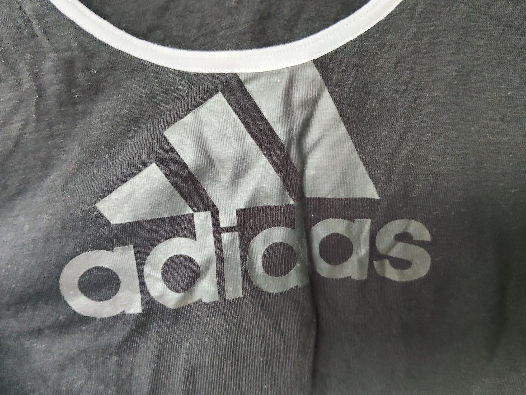 Adidas Black Tank Top with Logo (Category: Sleeveless) located in City of Isabela. Submitted by jasheverything (Listing ID 1449085773, Image 3). Description: - Classic Adidas logo on the front - White piping trim on neckline and armholes - Ideal for workouts or casual outings - Made with comfortable, breathable material Size Small to Med Excellent Condition 450+SF.