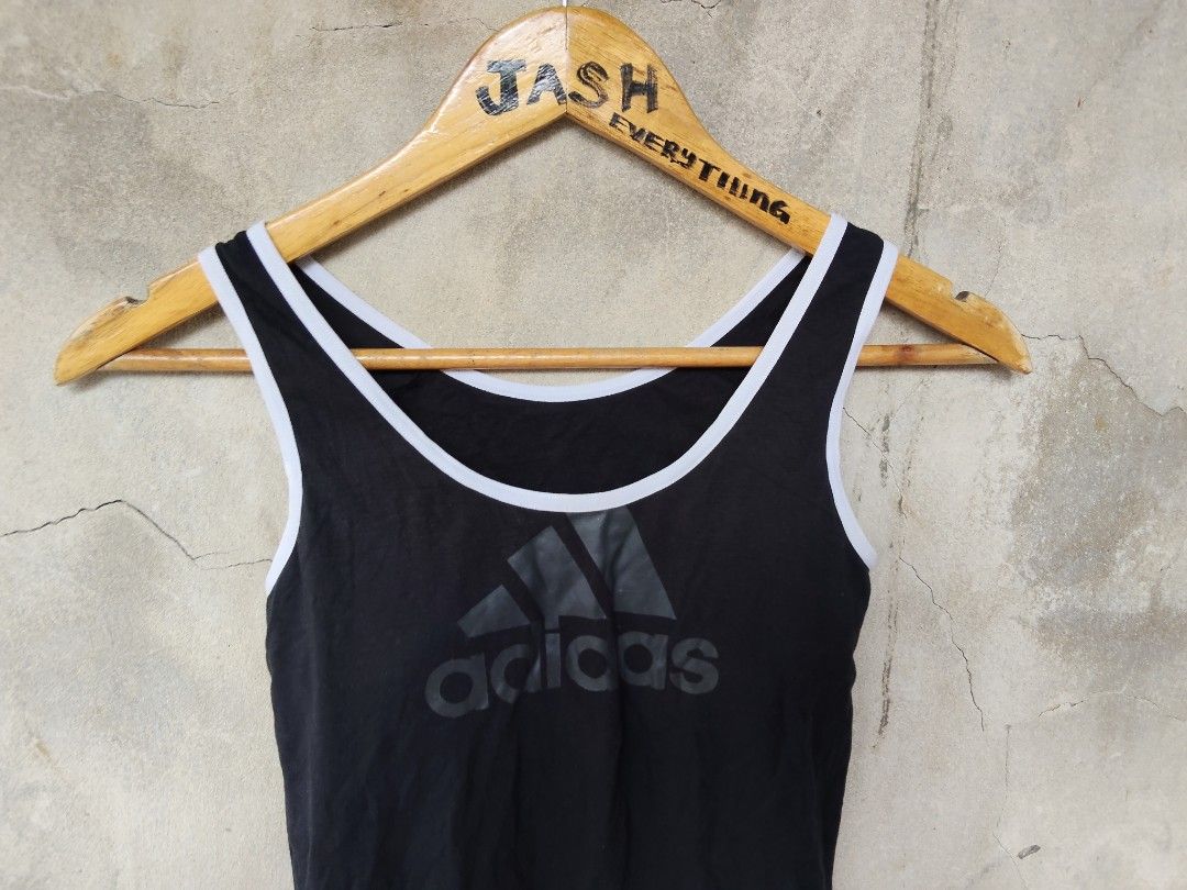 Adidas Black Tank Top with Logo (Category: Sleeveless) located in City of Isabela. Submitted by jasheverything (Listing ID 1449085773, Image 2). Description: - Classic Adidas logo on the front - White piping trim on neckline and armholes - Ideal for workouts or casual outings - Made with comfortable, breathable material Size Small to Med Excellent Condition 450+SF.