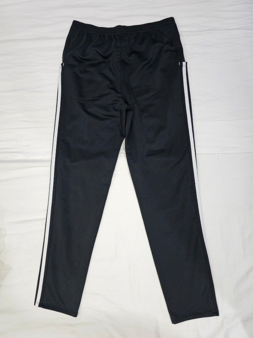 Adidas Black Track Pants with White Stripes (Category: Activewear) located in Quezon City. Submitted by fruncesdeclutters_ (Listing ID 1449071553, Image 2). Description: DM for more details. - Comfortable elastic waistband - Versatile for sports or casual wear - Easy to pair with any outfit.