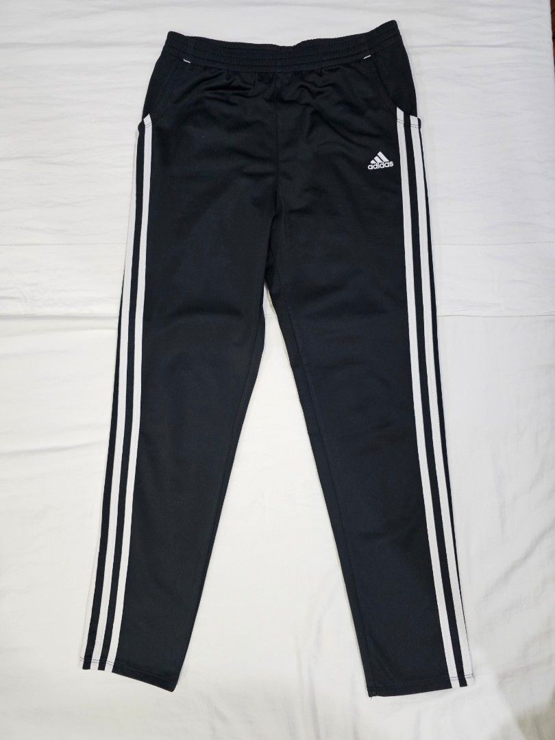 Adidas Black Track Pants with White Stripes (Category: Activewear) located in Quezon City. Submitted by fruncesdeclutters_ (Listing ID 1449071553, Image 1). Description: DM for more details. - Comfortable elastic waistband - Versatile for sports or casual wear - Easy to pair with any outfit.