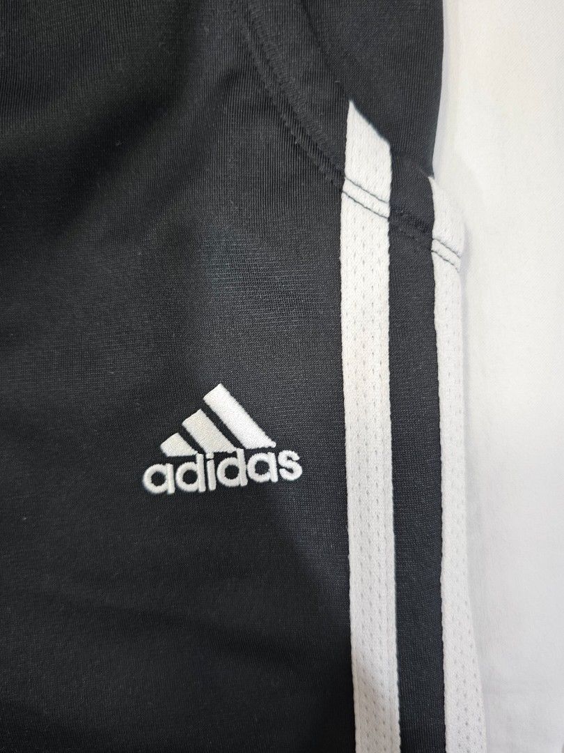 Adidas Black Track Pants with White Stripes (Category: Activewear) located in Quezon City. Submitted by fruncesdeclutters_ (Listing ID 1449071553, Image 3). Description: DM for more details. - Comfortable elastic waistband - Versatile for sports or casual wear - Easy to pair with any outfit.