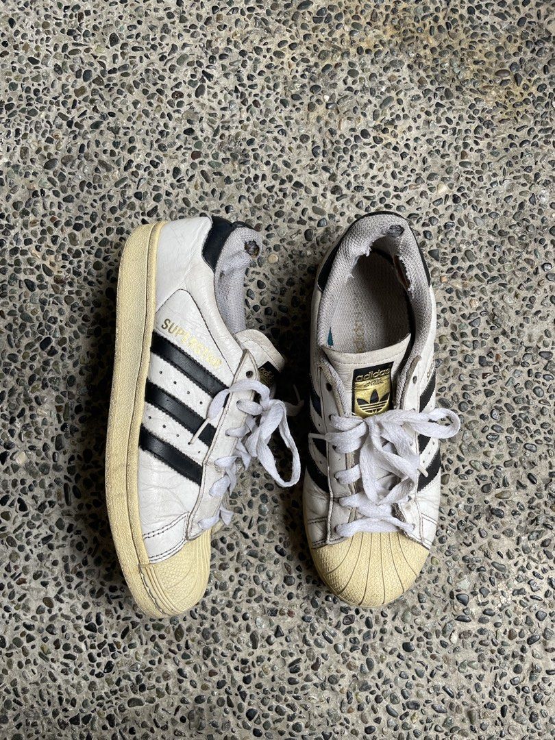Adidas Superstar Sneakers White Black (Category: Sneakers) located in Manila. Submitted by coollion_7aaba1 (Listing ID 1449083828, Image 3). Description: * Classic Adidas Superstar sneakers * Size 38 * Personally bought in Japan * Guaranteed no issues, just well-used with normal signs of wear.