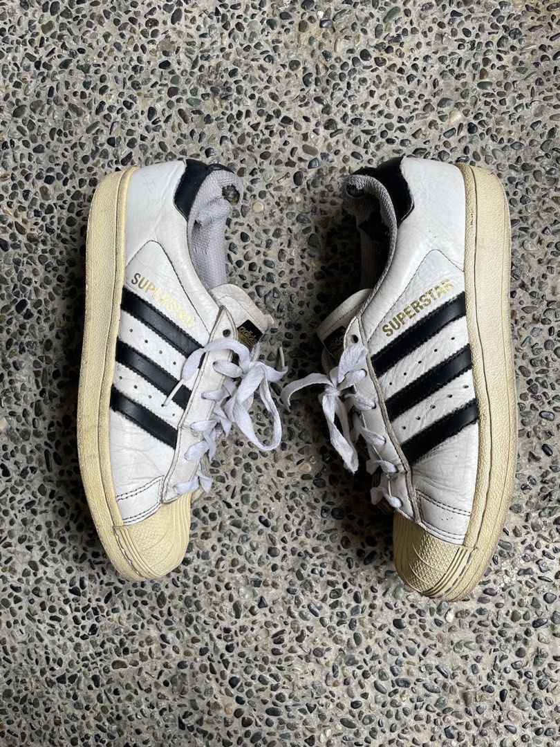 Adidas Superstar Sneakers White Black (Category: Sneakers) located in Manila. Submitted by coollion_7aaba1 (Listing ID 1449083828, Image 1). Description: * Classic Adidas Superstar sneakers * Size 38 * Personally bought in Japan * Guaranteed no issues, just well-used with normal signs of wear.