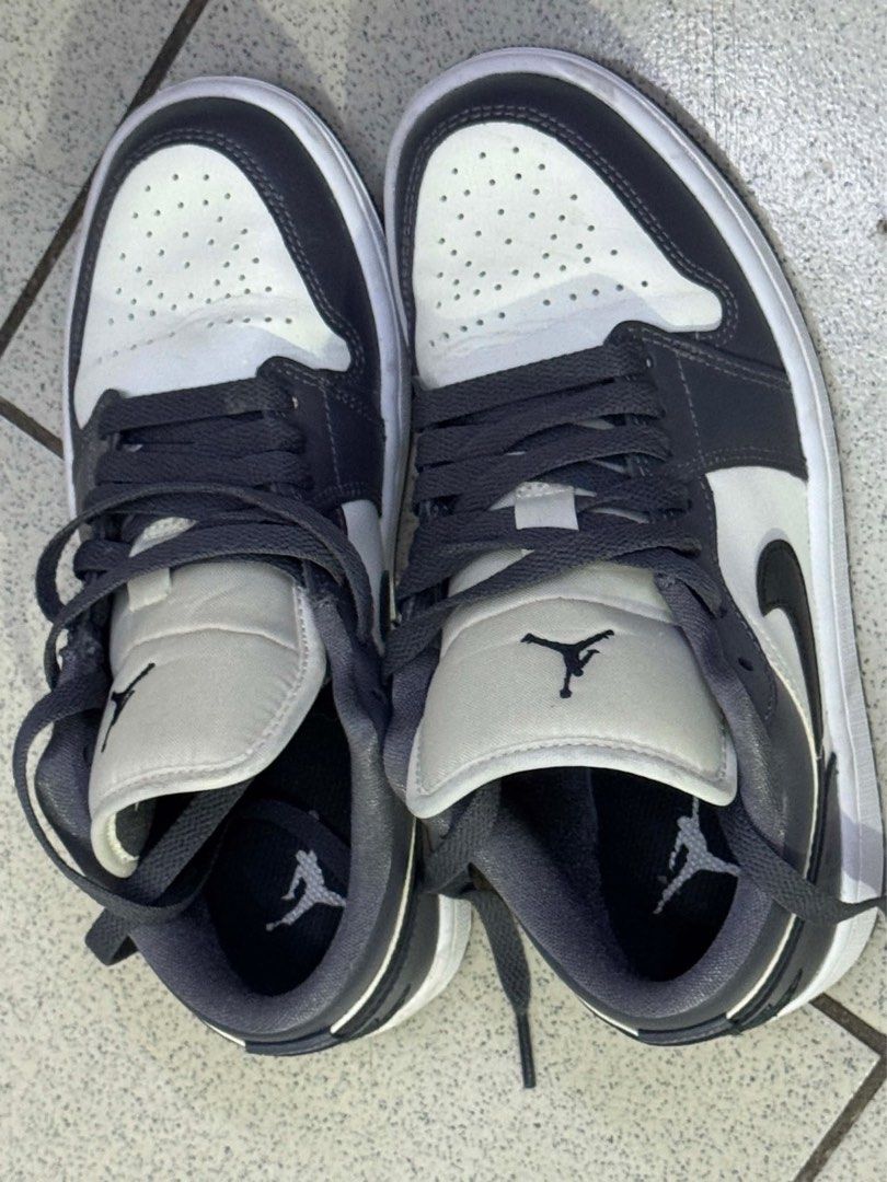 Air Jordan 1 Low Dark Grey White (Category: Sneakers) located in Caloocan City. Submitted by rhegmayo0124 (Listing ID 1448917199, Image 1). Description: - Authentic Air Jordan 1 Low sneakers - Classic dark grey and white colorway - Iconic Jumpman logo on tongue and insole - Embossed Wings logo on the heel - Versatile for casual wear or basketball.