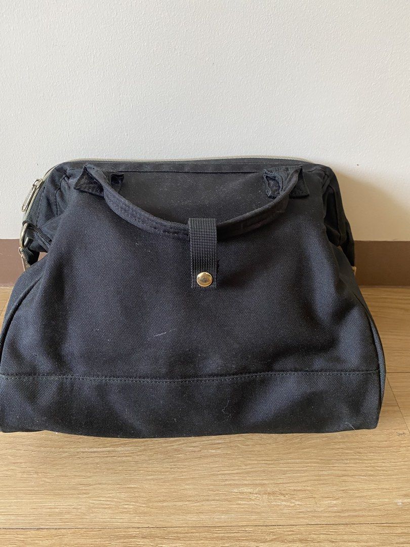 Anello Canvas Boston Bag Black (Category: Cross-body Bags) located in Mandaluyong City. Submitted by mac189 (Listing ID 1448969627, Image 2). Description: - Black canvas Anello bag - Top handles and detachable shoulder strap - Zippers in good working condition - Minor signs of wear on metal hardware - Ample interior space - Ideal for everyday use or travel.