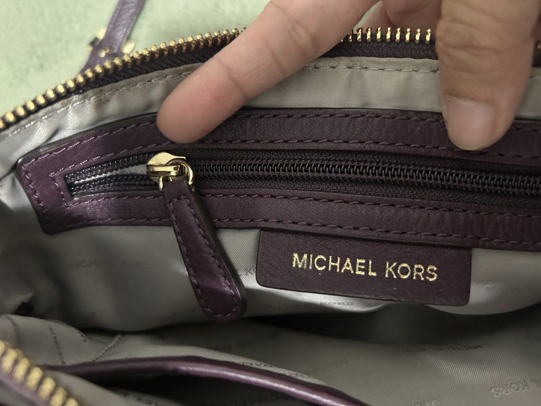 Authentic Michael Kors Purple Leather Wallet/Clutch with Strap (Category: Luxury Bags & Wallets) located in Las Pinas. Submitted by ladyattire (Listing ID 1449031132, Image 1). Description: - Authentic Michael Kors wallet - Color: Purple - Material: Pebbled leather - Hardware: Gold - Includes: Wrist strap and detachable crossbody strap - Interior: Multiple card slots - Comes with: Care card - Approximate Dimensions: 9 inches wide x 5 inches tall.