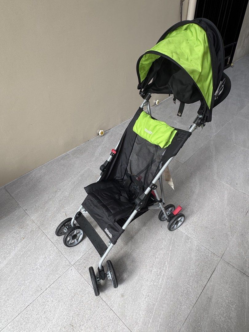 Kolcraft Baby Stroller - Lightweight and Foldable (Category: Strollers) located in Las Pinas. Submitted by vanethneth (Listing ID 1448971596, Image 3). Description: - Lightweight and easy to fold for portability - Stylish black frame with a vibrant green canopy - Secure 5-point harness for child's safety - Ideal for travel and everyday outings - The other wheel has flaw, it does not move but it can be fix - Shows minor signs of wear on frame and 