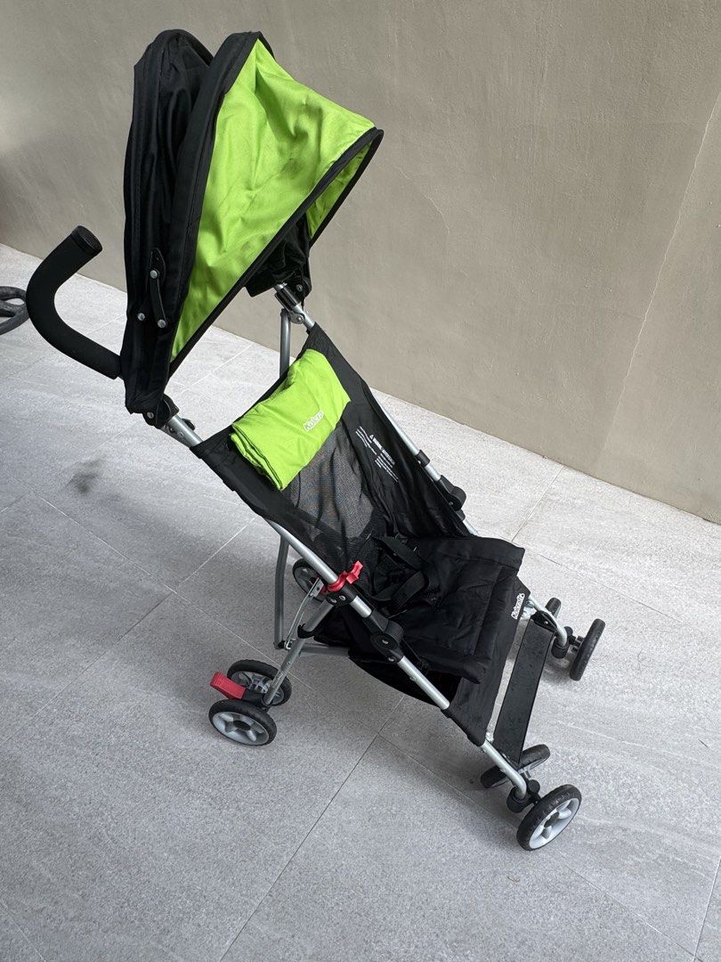 Kolcraft Baby Stroller - Lightweight and Foldable (Category: Strollers) located in Las Pinas. Submitted by vanethneth (Listing ID 1448971596, Image 2). Description: - Lightweight and easy to fold for portability - Stylish black frame with a vibrant green canopy - Secure 5-point harness for child's safety - Ideal for travel and everyday outings - The other wheel has flaw, it does not move but it can be fix - Shows minor signs of wear on frame and 