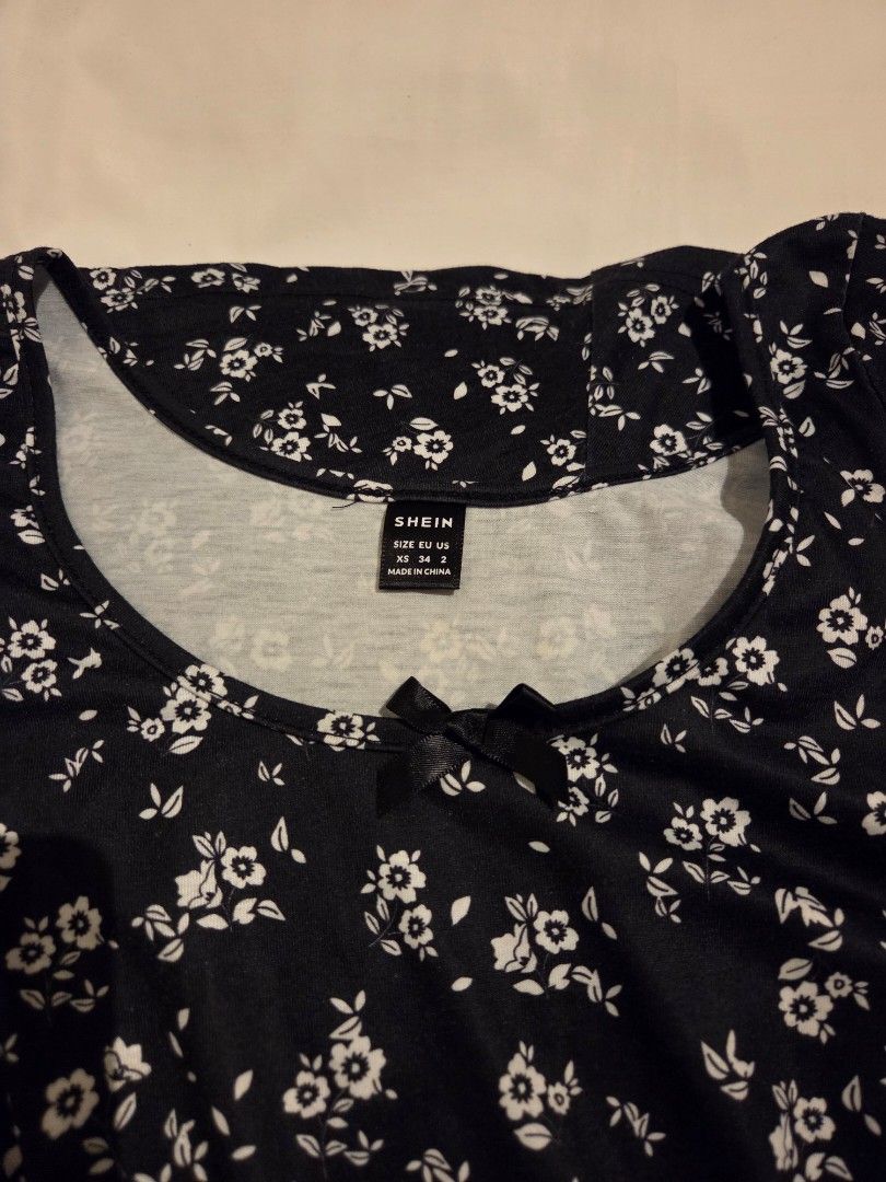 Black dress w/ white flower pattern XS (Category: Dresses) located in Makati City. Submitted by mandy.stuff (Listing ID 1449037463, Image 3). Description: Length: 76 cm / 30 in.