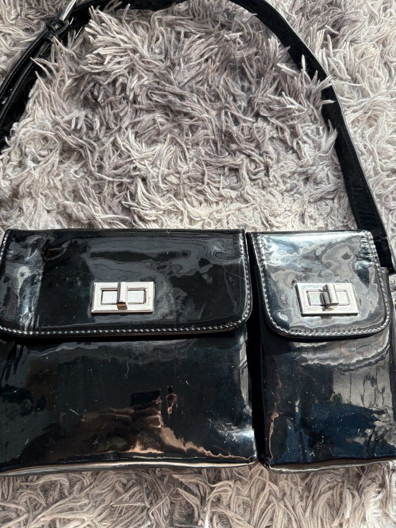 Black Patent Double-Pocket Shoulder Bag (Category: Shoulder Bags) located in Davao. Submitted by sweetlex (Listing ID 1449058389, Image 2). Description: Selling my preloved black patent shoulder bag. It has a glossy finish, two front pockets with turn-lock closures, and an adjustable strap. It’s a simple and versatile bag that’s easy to pair with any outfit. Condition: • Normal signs of use Please check all photos for the actual condition. 📍 San