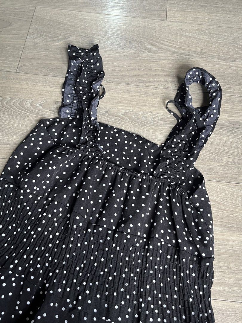 Black Polka Dot Tiered Ruffle Strap Maxi Dress (Category: Dresses) located in Mandaluyong City. Submitted by namislounge (Listing ID 1448969576, Image 3). Description: Can fit from 28-36 waist/bust | ~ 43 inches length - Cute black dress with white polka dots - Adorable ruffle straps - Flowy tiered hemline - Versatile for casual outings - Easy to style with sandals or sneakers Issue: Loose ruffled strap (can be cut or made into an off-shoulder de