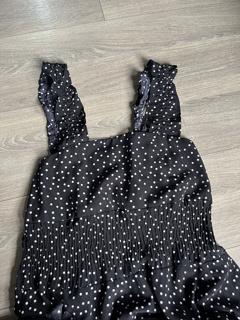 Black Polka Dot Tiered Ruffle Strap Maxi Dress (Category: Dresses) located in Mandaluyong City. Submitted by namislounge (Listing ID 1448969576, Image 2). Description: Can fit from 28-36 waist/bust | ~ 43 inches length - Cute black dress with white polka dots - Adorable ruffle straps - Flowy tiered hemline - Versatile for casual outings - Easy to style with sandals or sneakers Issue: Loose ruffled strap (can be cut or made into an off-shoulder de