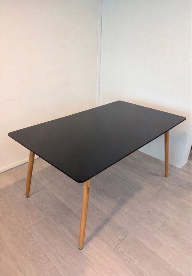 Black Rectangular Dining Table (Category: Tables & Sets) located in Singapore. Submitted by weekiat_21 (Listing ID 1448967184, Image 1). Description: - Four tapered wooden legs with metal caps - Versatile: great for dining or as a workspace - Easy-to-clean surface - Perfect for modern or minimalist interiors 120 x 80.