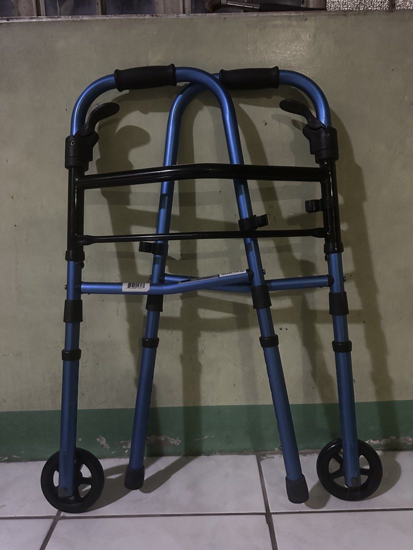 Blue Folding Walker with Wheels (Category: Everything Else Others) located in Marikina City. Submitted by chestmaester708 (Listing ID 1449033453, Image 1). Description: - Blue folding walker - Front wheels for easier movement - Folds up for convenient storage - Provides excellent mobility assistance - Ready for its next owner.