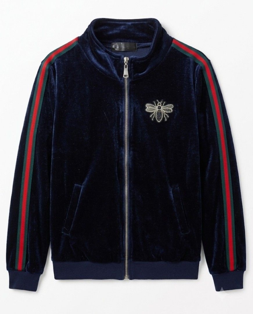 BLUE Velvet Track Jacket with Bee Embroidery (Category: Coats, Jackets and Outerwear) located in Donsol. Submitted by saksthriftavenuebyluckymaria8 (Listing ID 1448907541, Image 3). Description: - Navy blue velvet track jacket - Iconic green and red stripe down the sleeves - Embroidered bee detail on the chest - Zip-up front with a stand-up collar - Ribbed cuffs and hem - Super comfy and stylish Chest 22in armhole 10in shoulder 16in length 23in s