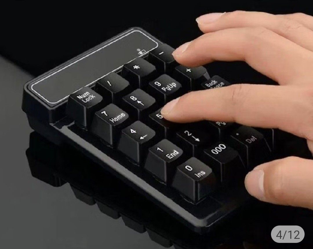 Bluetooth Numeric Keypad (Category: Computer Keyboard) located in Singapore. Submitted by zard42 (Listing ID 1448978439, Image 1). Description: - Black numeric keypad - Slim design, 135mm length - bluetooth connectivity - Includes Num Lock, Home, End, 000, Backspace, Enter, and Delete keys - Perfect for efficient data entry and quick number typing.