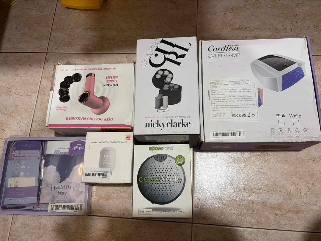 BUNDLE 3 (Category: Massage Devices) located in Singapore. Submitted by blaankxx (Listing ID 1449058341, Image 1). Description: - Bundle of beauty & personal care items - Pink deep rolling massager - Cordless UV LED nail lamp - Boompods speaker - Assorted skincare or cosmetic items - All items in original packaging - Ideal for personal use or as a gift.