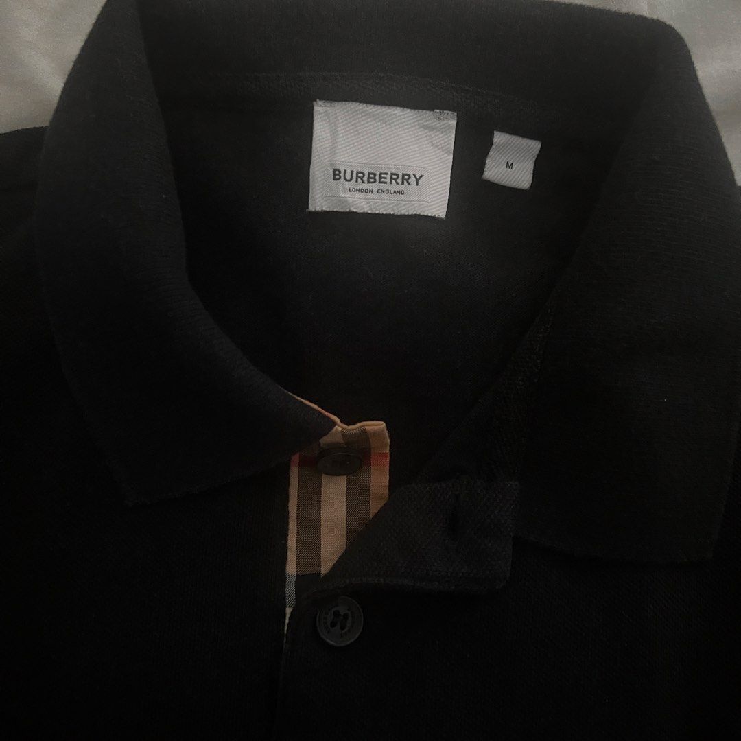 Burberry Black Polo Shirt with TB Monogram (Category: Tshirts & Polo Shirts ) located in Marikina City. Submitted by jamesdg (Listing ID 1448898528, Image 2). Description: Burberry Polo Shirt Size M No issues Color rate: 10/10 Dimension: 19.5x27-28 Guaranteed Original/Legit/Authentic.