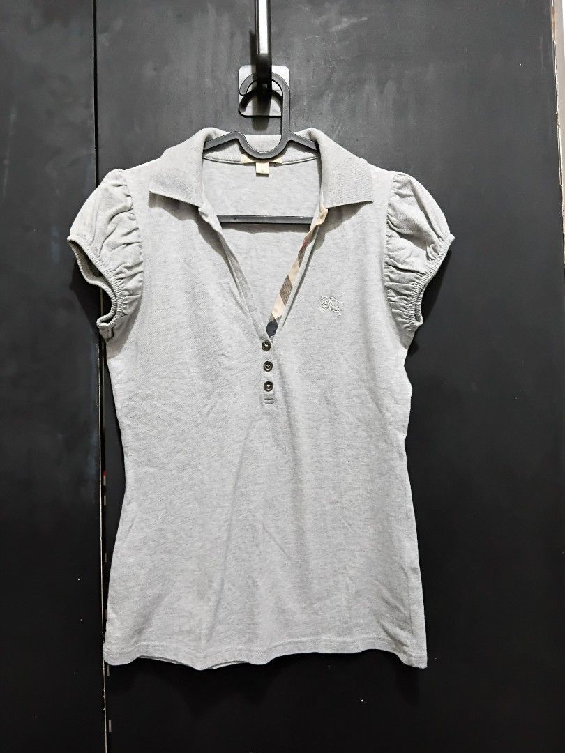 Burberry Grey Polo Shirt Size S (Category: Tshirts & Polo Shirts ) located in Manila. Submitted by ramcyanthony (Listing ID 1449070814, Image 2). Description: - Grey Authentic Burberry Polo Shirt - bust 17in length 24in - complete washtags - Short sleeves with gathered detail stretchy - Classic collar with button closure - Embroidered Burberry logo on chest - Made in Turkey - Material: 98% Cotton, 2% Elastane.