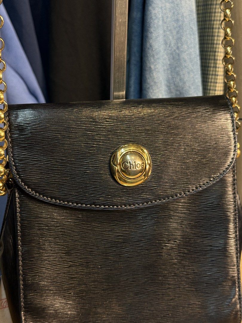 Chloe Black Leather Chain Shoulder Bag (Category: Luxury Bags & Wallets) located in Manila. Submitted by keantuttt (Listing ID 1449034233, Image 2). Description: - Authentic Chloe black leather shoulder bag - Elegant gold chain strap - Signature Chloe logo on front clasp and interior - Minor wear on strap edge, as pictured - Interior is clean and well-maintained - A versatile and classic addition to any wardrobe.