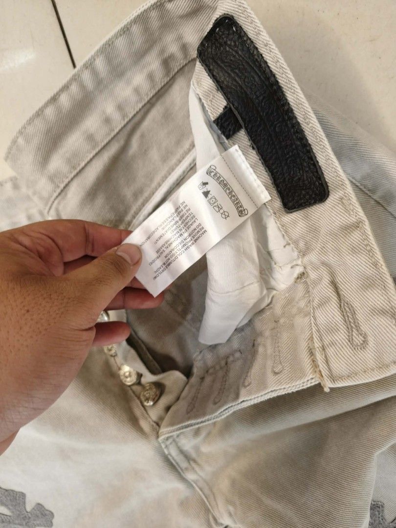 Chrome Hearts x Levi's 501 Jeans (Category: Jeans) located in Manila. Submitted by matthewlla74087 (Listing ID 1448983904, Image 3). Description: 32x40 - Classic Levi's 501 fit - Light wash denim - Unique cross embellishments throughout - Button fly closure - Iconic red tab and orange leather patch - Perfect statement piece for your wardrobe.