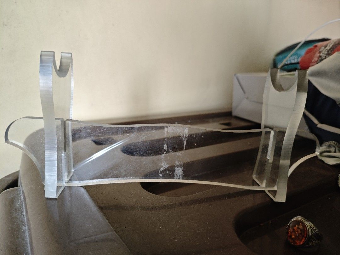 Clear Acrylic Display Lightsaber stand (Category: Other Home Decor) located in Manila. Submitted by fiercemountain-cef6 (Listing ID 1449004426, Image 2). Description: - Clear acrylic display stand - Two slots on each side to hold items upright - Made of sturdy acrylic material - Ideal for displaying lightsabers - Shows minor scuffs from handling -Can get for a lower price if sure buyer.