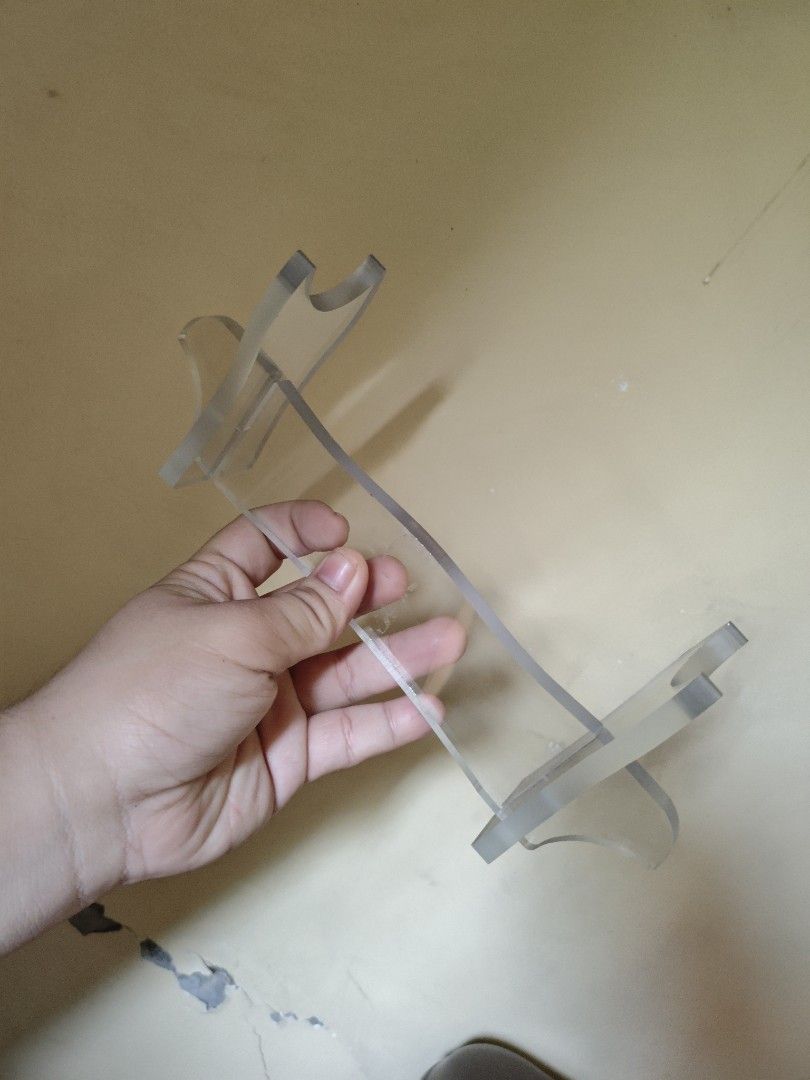 Clear Acrylic Display Lightsaber stand (Category: Other Home Decor) located in Manila. Submitted by fiercemountain-cef6 (Listing ID 1449004426, Image 1). Description: - Clear acrylic display stand - Two slots on each side to hold items upright - Made of sturdy acrylic material - Ideal for displaying lightsabers - Shows minor scuffs from handling -Can get for a lower price if sure buyer.