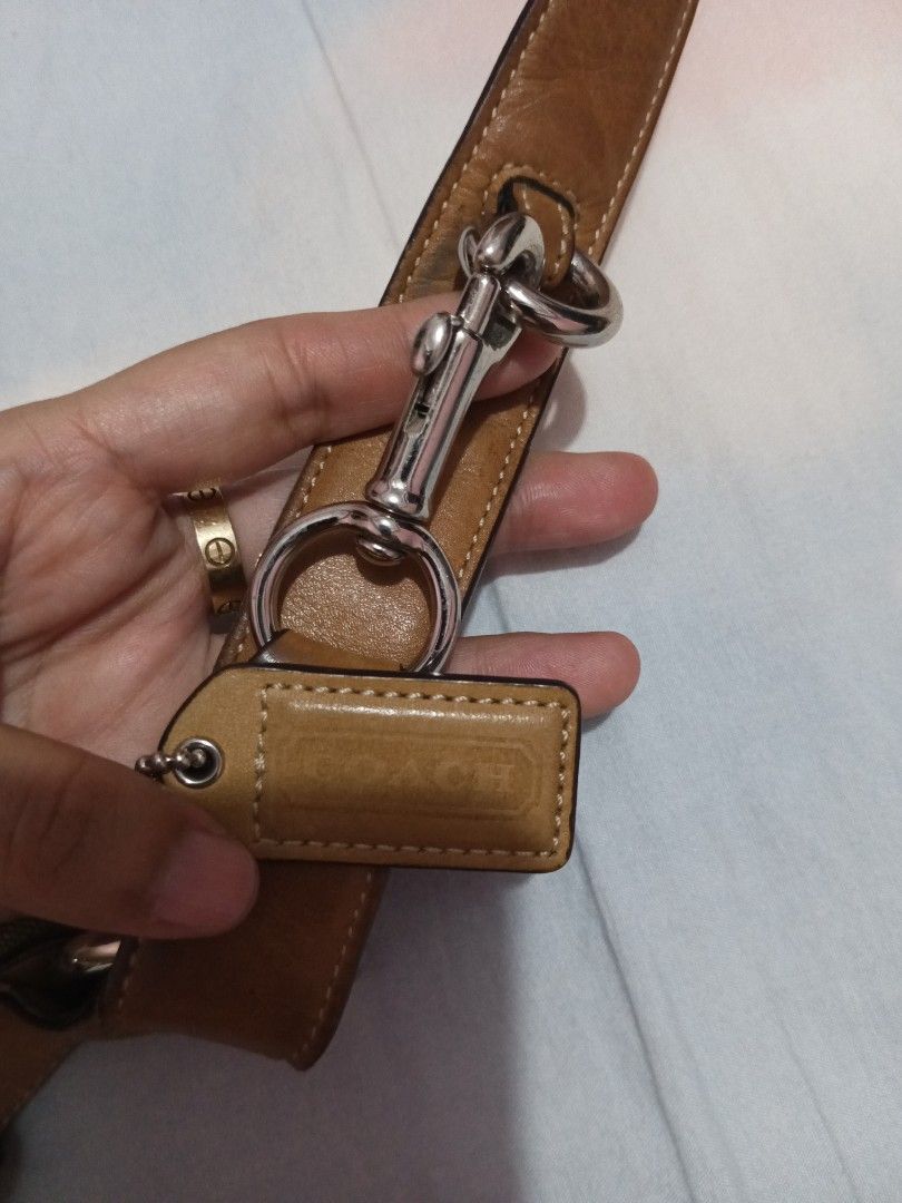 Coach Monogram Canvas Leather Crossbody Bag (Category: Luxury Bags & Wallets) located in Baliuag. Submitted by mazieee (Listing ID 1449063579, Image 2). Description: - Brown Coach monogram canvas crossbody bag - Tan leather trim and strap - Silver buckle details on the front - Adjustable strap with metal clasp - Small leather tag attached to the strap - Great everyday bag NEGOTIABLE 🙂.