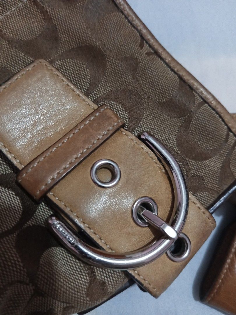 Coach Monogram Canvas Leather Crossbody Bag (Category: Luxury Bags & Wallets) located in Baliuag. Submitted by mazieee (Listing ID 1449063579, Image 3). Description: - Brown Coach monogram canvas crossbody bag - Tan leather trim and strap - Silver buckle details on the front - Adjustable strap with metal clasp - Small leather tag attached to the strap - Great everyday bag NEGOTIABLE 🙂.