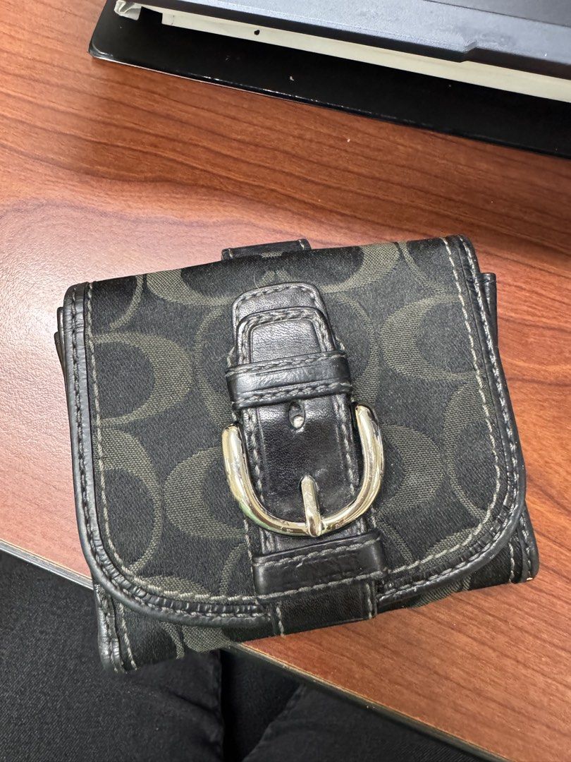 Coach Signature C Monogram Tri-Fold Wallet (Category: Luxury Bags & Wallets) located in Calamba. Submitted by gnbpreloved (Listing ID 1448924157, Image 1). Description: - Authentic Coach wallet with classic signature C monogram pattern. - Stylish black and light blue colorway. - Convenient tri-fold design with a secure buckle closure. - Interior features multiple card slots and a clear ID window. - Interior snap closure for added security. - Show