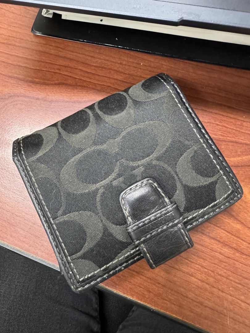 Coach Signature C Monogram Tri-Fold Wallet (Category: Luxury Bags & Wallets) located in Calamba. Submitted by gnbpreloved (Listing ID 1448924157, Image 2). Description: - Authentic Coach wallet with classic signature C monogram pattern. - Stylish black and light blue colorway. - Convenient tri-fold design with a secure buckle closure. - Interior features multiple card slots and a clear ID window. - Interior snap closure for added security. - Show