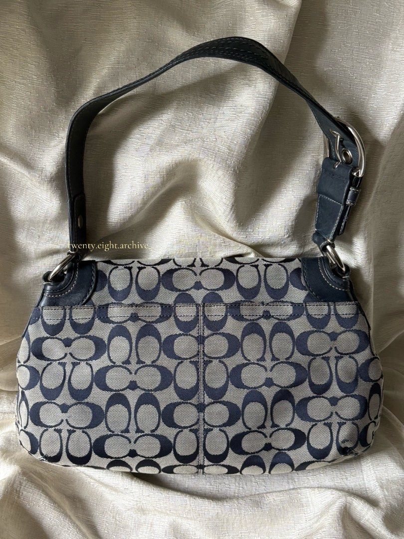 Coach Soho Flap (Category: Luxury Bags & Wallets) located in Bacoor. Submitted by twenty_eight_archive (Listing ID 1449086611, Image 3). Description: - Classic Coach monogram shoulder bag - Signature C pattern in navy and beige - Genuine leather trim and strap - Silver hardware details - Ideal for everyday use.