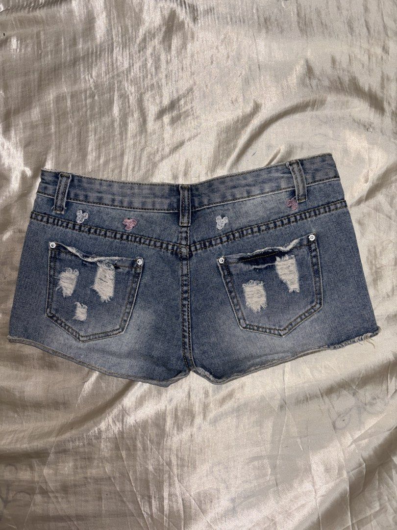 Denim Shorts with Mickey Mouse Embroidery (Category: Shorts) located in Muntinlupa City. Submitted by aoki29 (Listing ID 1449098722, Image 2). Description: - Light wash denim shorts - Distressed rips and frayed hem - Cute scattered butterfly embroidery - Button and zip closure - Two front and two back pockets - Ideal for casual wear.