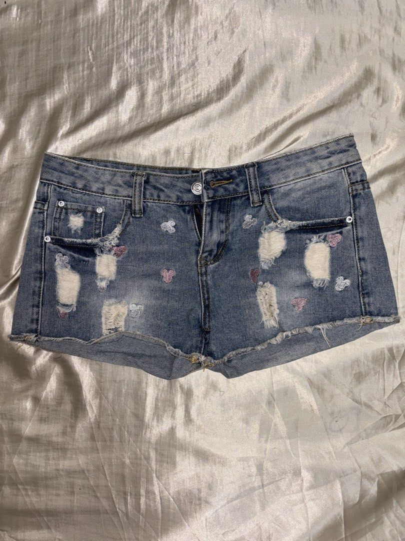 Denim Shorts with Mickey Mouse Embroidery (Category: Shorts) located in Muntinlupa City. Submitted by aoki29 (Listing ID 1449098722, Image 1). Description: - Light wash denim shorts - Distressed rips and frayed hem - Cute scattered butterfly embroidery - Button and zip closure - Two front and two back pockets - Ideal for casual wear.