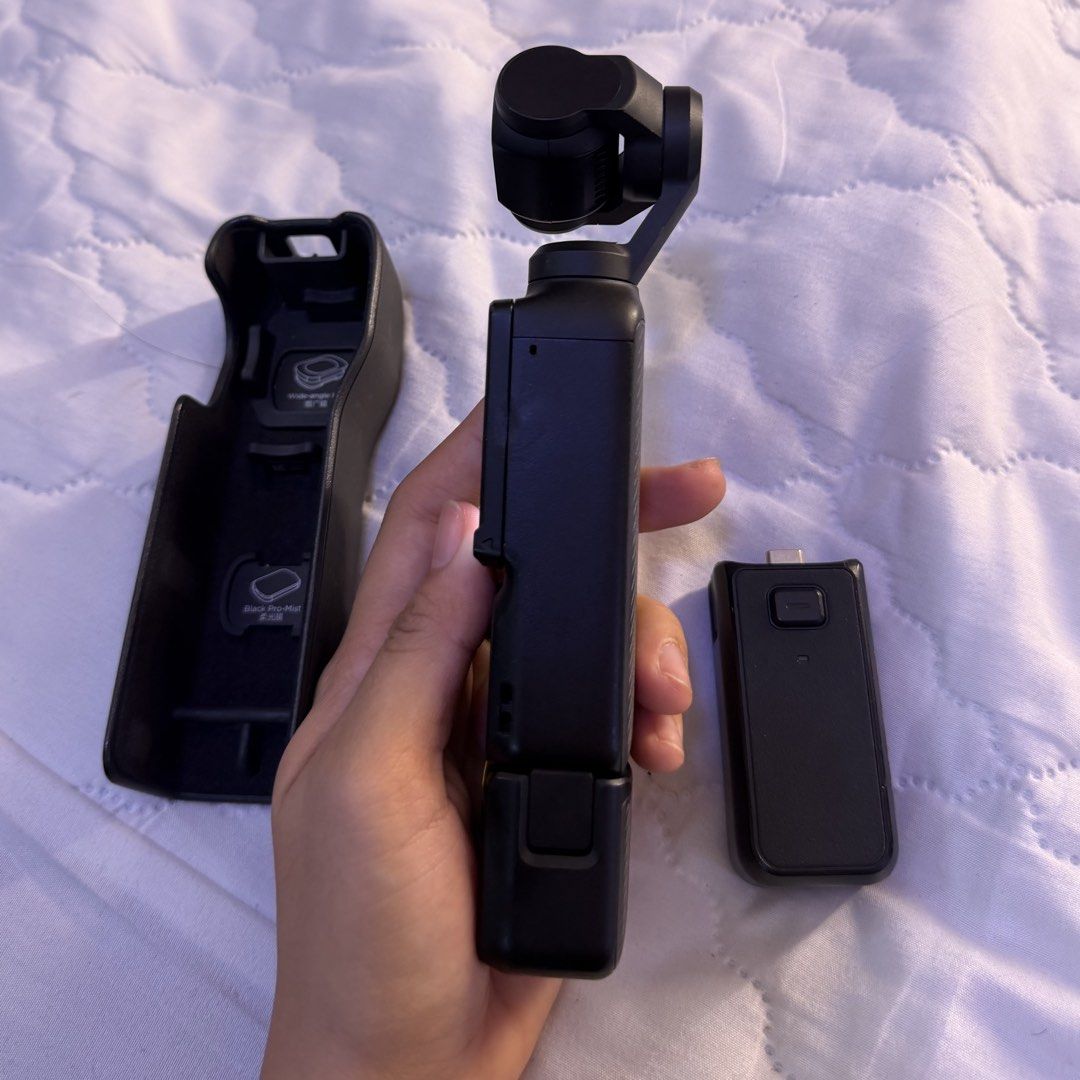 DJI Osmo Pocket 3 Gimbal Camera with Accessories (Category: Cameras) located in Manila. Submitted by krezhamae74797 (Listing ID 1448936678, Image 3). Description: - DJI Osmo Pocket 3 Compact Gimbal Camera - Includes Charging Case - Includes USB-C Adapter - Ideal for Vlogging - Captures Smooth, Stable Footage - Perfect for Travel and Adventures.