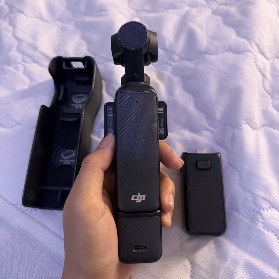 DJI Osmo Pocket 3 Gimbal Camera with Accessories (Category: Cameras) located in Manila. Submitted by krezhamae74797 (Listing ID 1448936678, Image 2). Description: - DJI Osmo Pocket 3 Compact Gimbal Camera - Includes Charging Case - Includes USB-C Adapter - Ideal for Vlogging - Captures Smooth, Stable Footage - Perfect for Travel and Adventures.